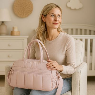 SAC A LANGER ONAE maman assise sac a langer rose