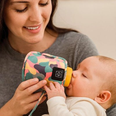chauffe biberon portable lidia bebe prend biberon