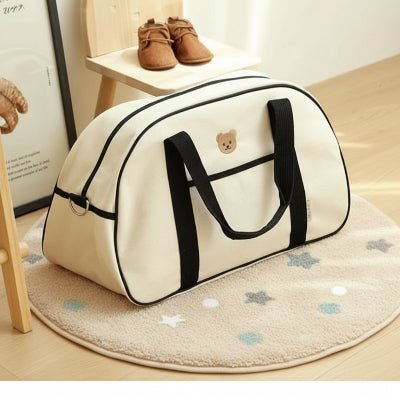 sac maternite orya sac sangle noir tapis